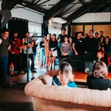 group of people standing inside room